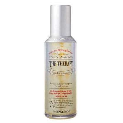 The Face Shop The Therapy oil-drop anti-aging serum in a clear glass bottle with a dropper dispenser