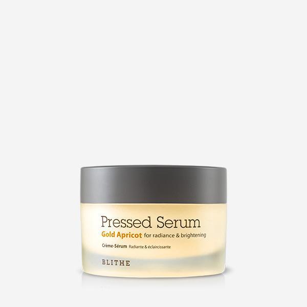 Blithe pressed serum gold apricot in a 50ml jar with a warm golden hue