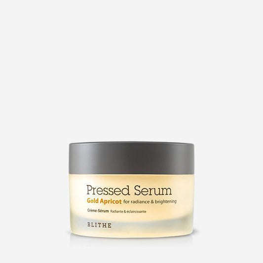 Blithe pressed serum gold apricot in a 50ml jar with a warm golden hue