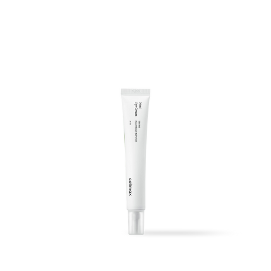 Celimax The Real Noni Ultimate Eye Cream in a slim green and white squeeze tube with a precision tip applicator