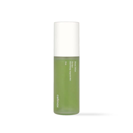 Celimax The Real Noni Energy Ampoule Mist in a clear spray bottle with vibrant green liquid and a white cap