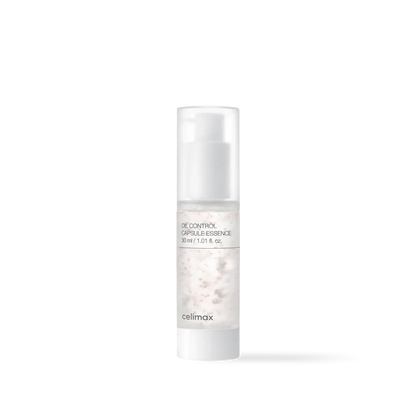 Celimax Oil Control Capsule Essence in a clear glass bottle with blue moisture capsules and a white pump top
