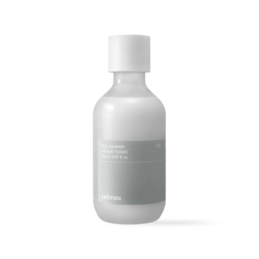 Celimax Dual Barrier Creamy Toner in a frosted bottle with milky white liquid and a minimalist blue label