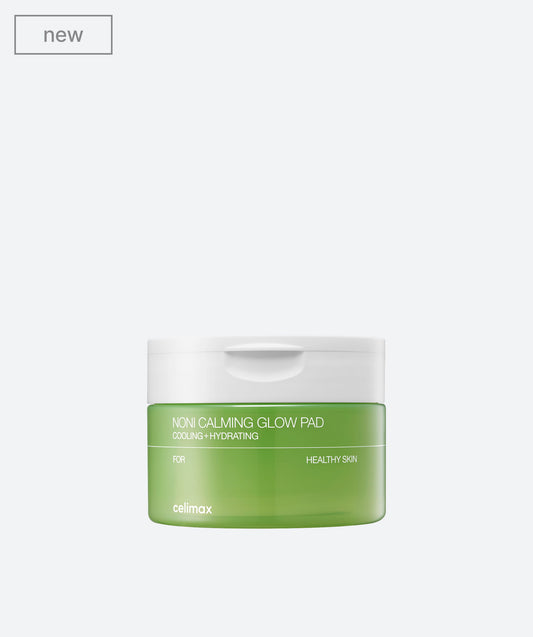 Celimax The Real Noni Calming Glow Pad in a green jar with textured round toner pads inside