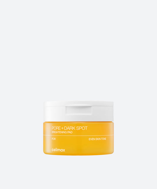 Celimax Pore and Dark Spot Brightening Pad 80 count in a clear jar with yellow toner soaked round cotton pads