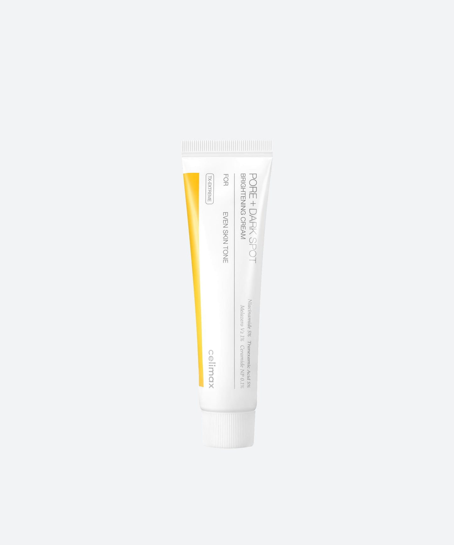 Celimax Pore and Dark Spot Brightening Cream in a white squeeze tube with a silver cap and yellow accents