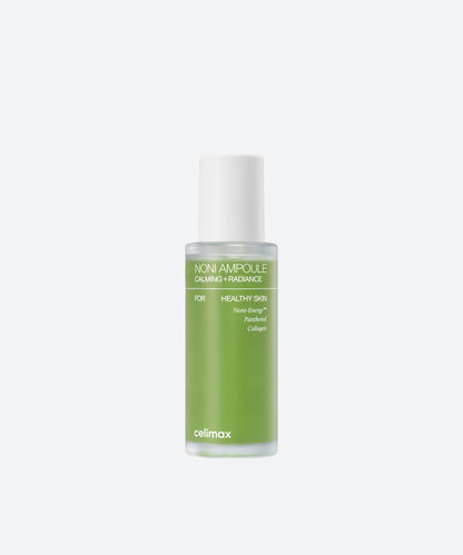 Celimax The Real Noni Energy Ampoule in a clear glass bottle with vibrant green liquid and a white dropper cap