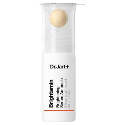 Dr. Jart Britamine Brightening Serum in a small yellow and white pump bottle with a clear cap