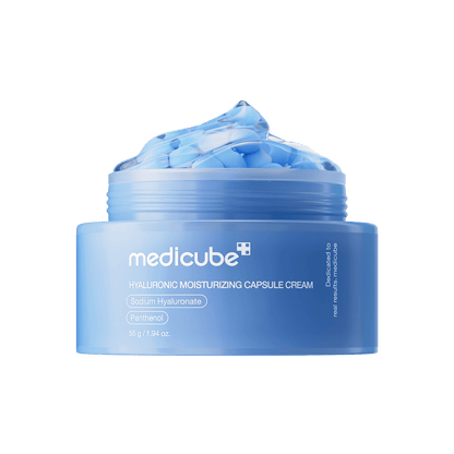 Medicube Hyaluronic Moisturizing Capsule Cream in a clear jar featuring small blue suspended moisture capsules