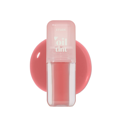 Etude House Dear Darling Oil Tint in Honey Vanilla, a pale nude lip gloss in a clear tube with a peach cap