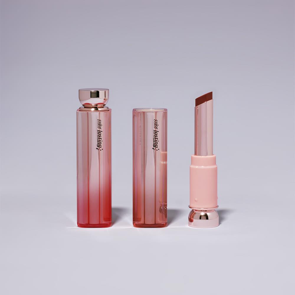 Etude House Color Lasting Glow Stick 08 Muted Brown, a glossy lip tint stick in a slim silver and pink tube