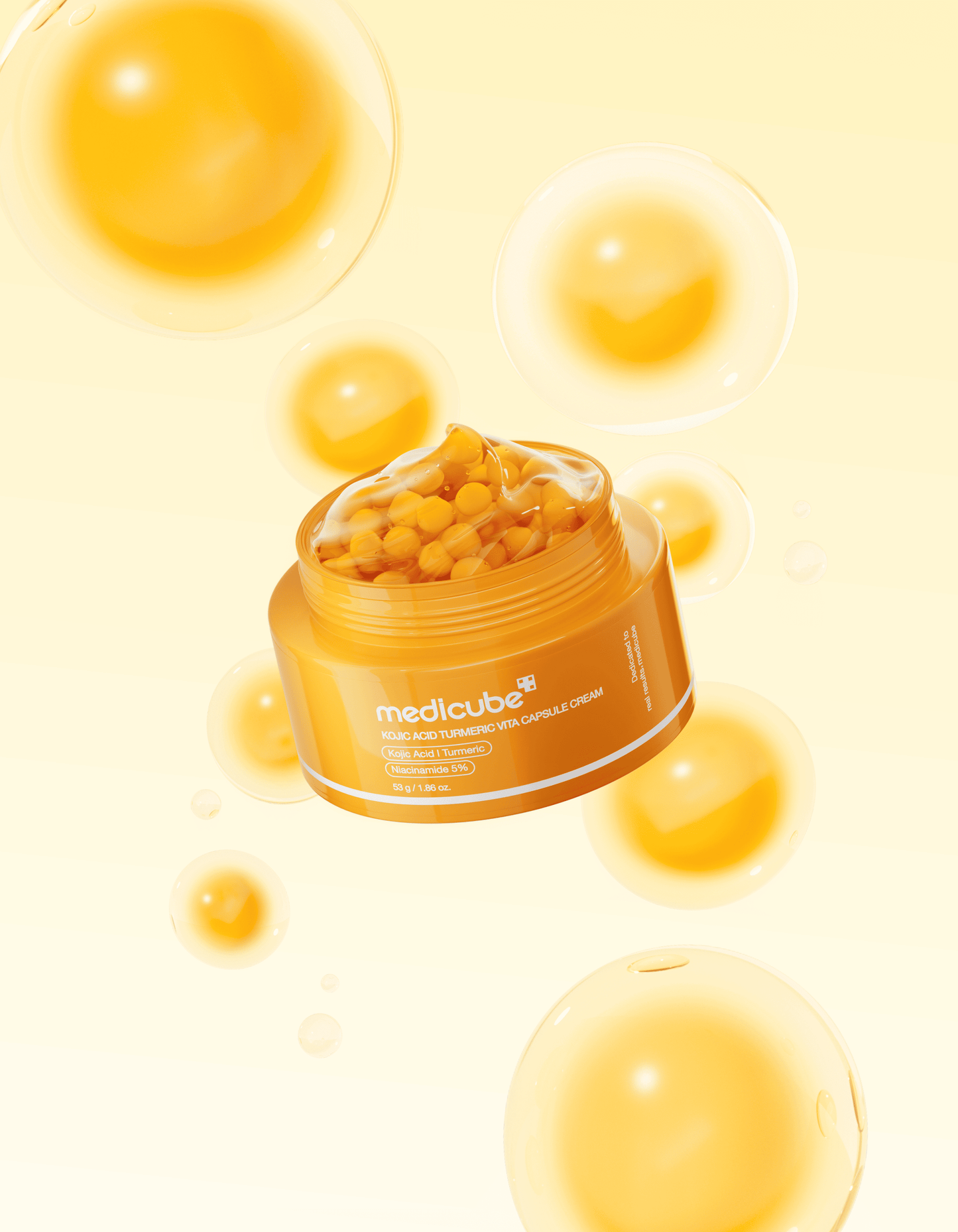 Medicube Kojic Acid Turmeric Vita Capsule Cream in a clear jar with yellow vitamin capsules suspended in white cream