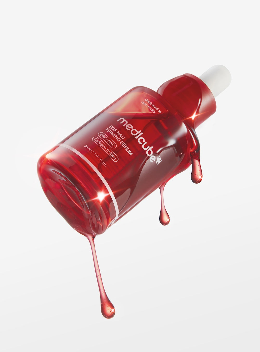 Medicube EGF NAD Firming Serum in a metallic silver pump bottle with blue accents