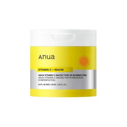 Anua Vitamin C Niacin Tone Up Blemish Pads in a yellow jar with square-shaped textured cotton pads inside
