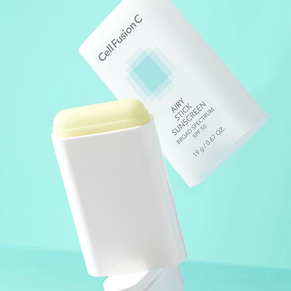 CellFusionC Airy Stick Sunscreen in a compact white and orange twist-up tube