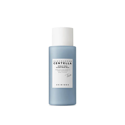 SKIN1004 Madagascar Centella Hyalu-Cica Glass Skin Milk in a tall translucent blue bottle with a white pump dispenser