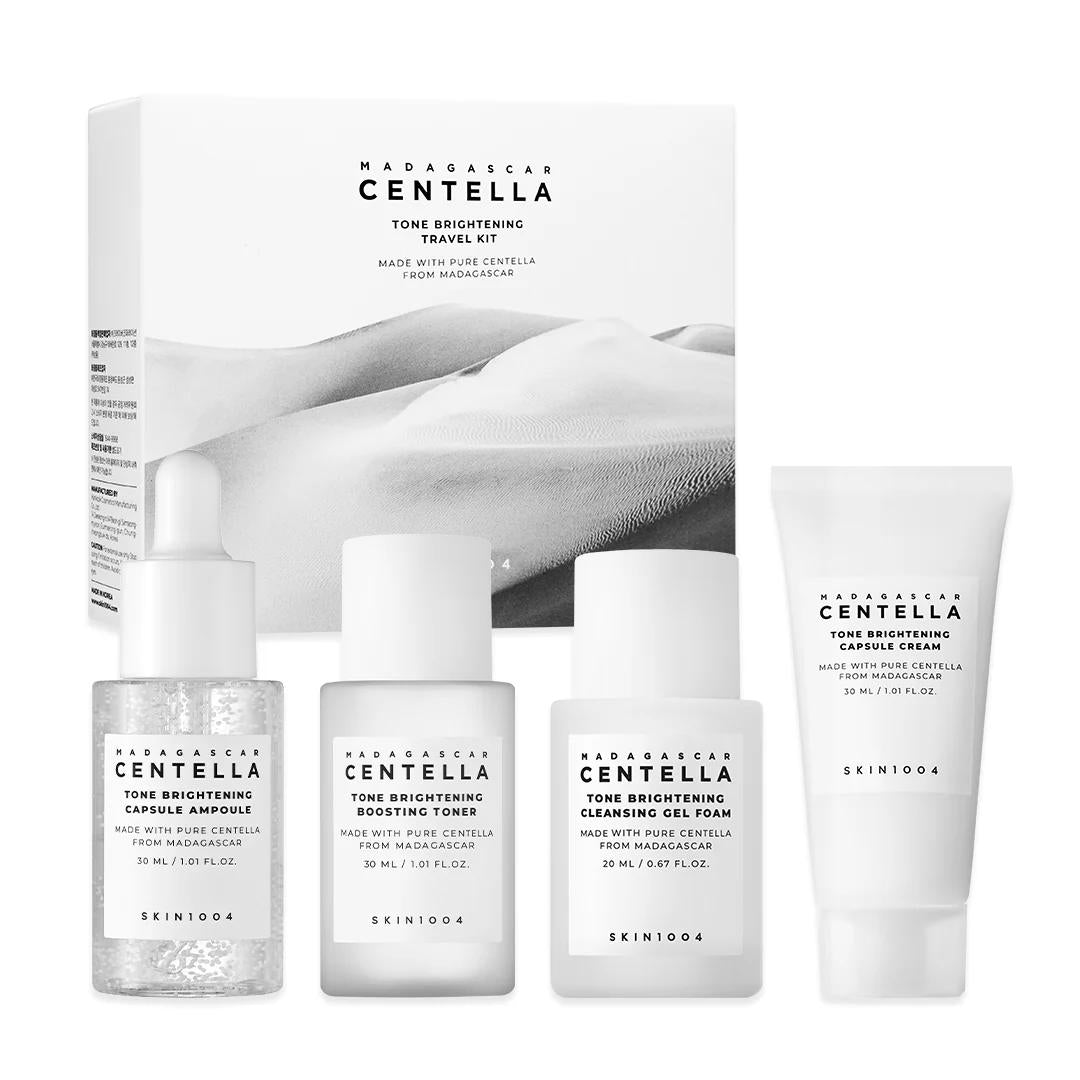 SKIN1004 Madagascar Centella Tone Brightening Travel Kit with four white and silver bottles in a clear pouch