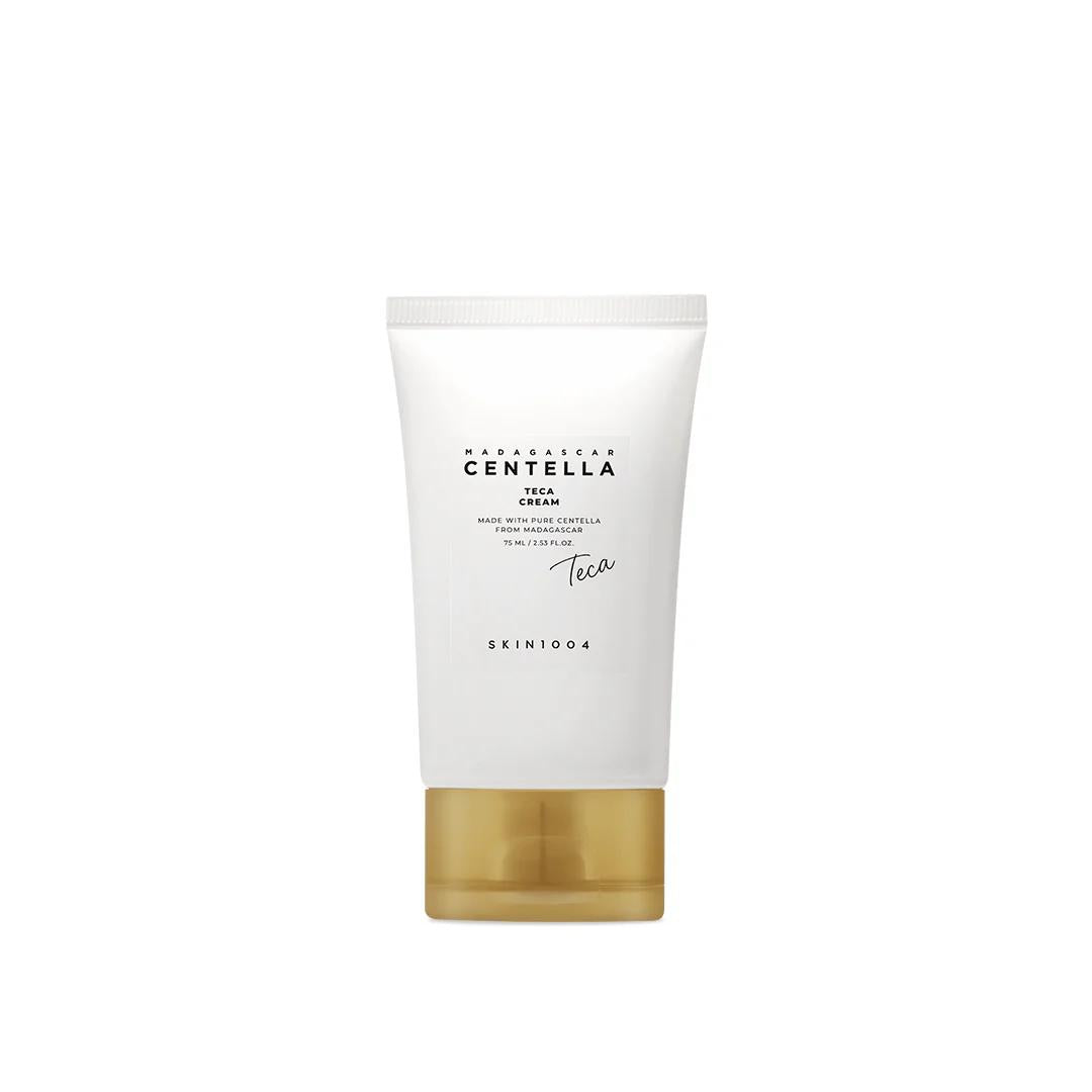 Skin1004 Madagascar Centella Teca Cream in a white and orange squeeze tube with a silver screw cap