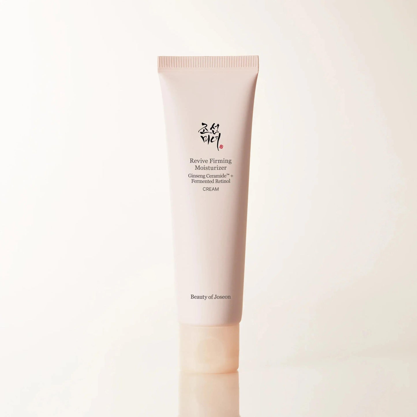 Beauty of Joseon Revive Firming Moisturizer in a white jar with a beige label and ginseng retinol ingredients