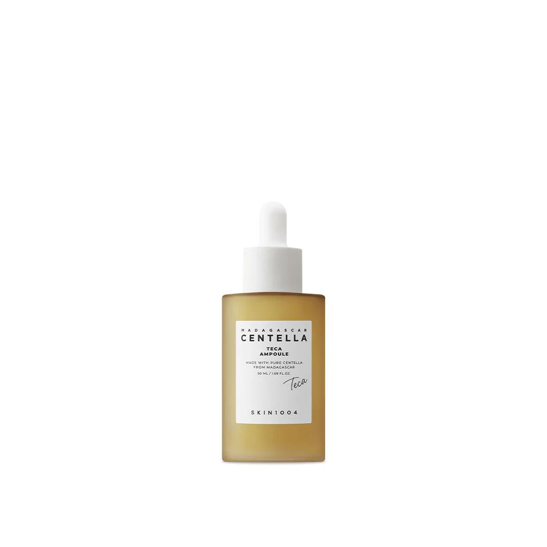 SKIN1004 Madagascar Centella Teca Ampoule in a frosted glass bottle with a white dropper cap and minimalist label
