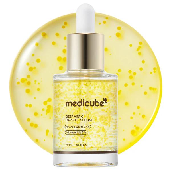 Medicube Deep Vita C Capsule Serum in a clear bottle with visible orange vitamin capsules and silver pump top